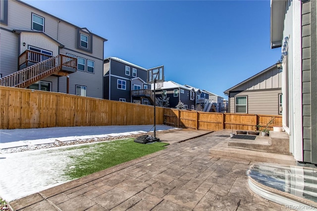 view of patio / terrace with a fenced backyard and a residential view