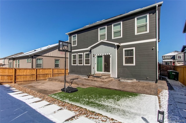 view of front of house with a residential view, a patio, a fenced backyard, and entry steps