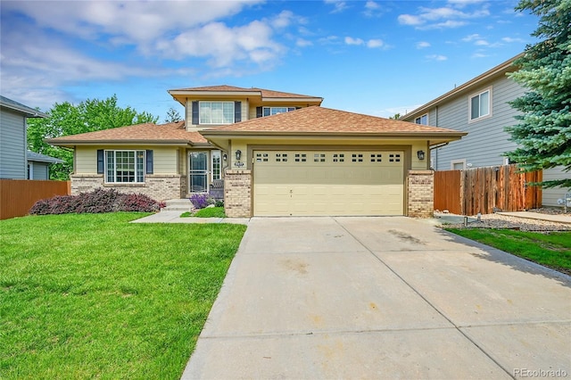 2631 S Flanders Ct, Aurora, CO 80013 - prairie-style home with brick siding, driveway, an attached garage, and a shingled roof