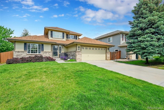2631 S Flanders Ct, Aurora, CO 80013 - view of front facade with brick siding, a garage, and driveway