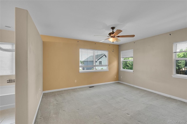 2631 S Flanders Ct, Aurora, CO 80013 - unfurnished room featuring plenty of natural light, a ceiling fan, and baseboards