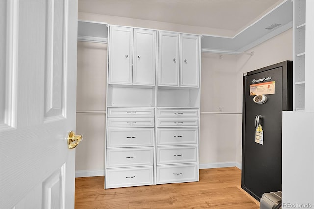 2631 S Flanders Ct, Aurora, CO 80013 - walk in closet with light wood finished floors