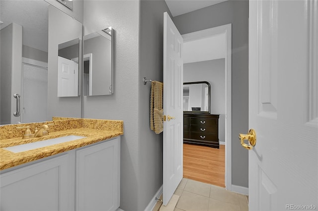 2631 S Flanders Ct, Aurora, CO 80013 - bathroom with vanity, tile patterned flooring, and baseboards