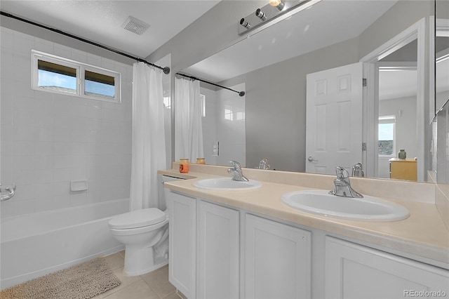 2631 S Flanders Ct, Aurora, CO 80013 - full bath featuring shower / tub combo, tile patterned floors, toilet, and double vanity
