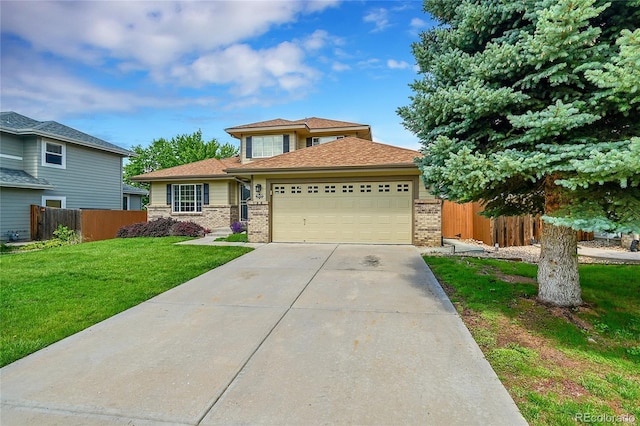 2631 S Flanders Ct, Aurora, CO 80013 - view of front of property featuring brick siding, an attached garage, driveway, and a shingled roof