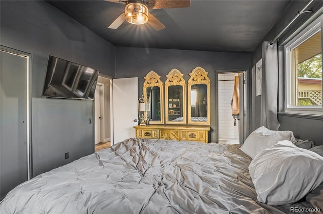 bedroom featuring ceiling fan and ensuite bathroom