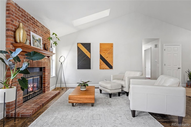 living room with dark hardwood / wood-style flooring, a fireplace, and vaulted ceiling with skylight