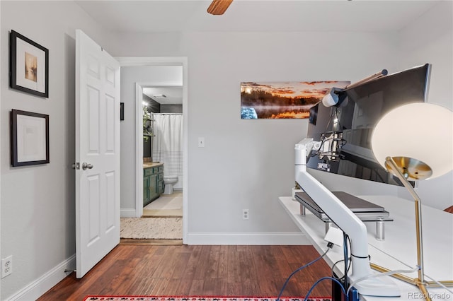 office space featuring ceiling fan and dark wood-type flooring