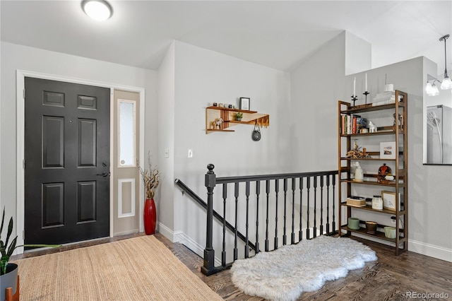 foyer entrance with dark wood-type flooring