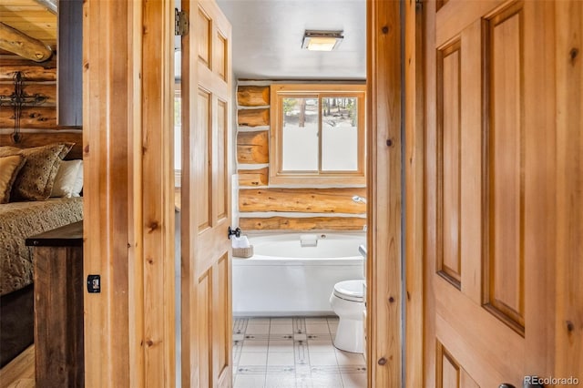 795 Zebulon St, Alma, CO 80420 - full bath featuring log walls, toilet, and a garden tub