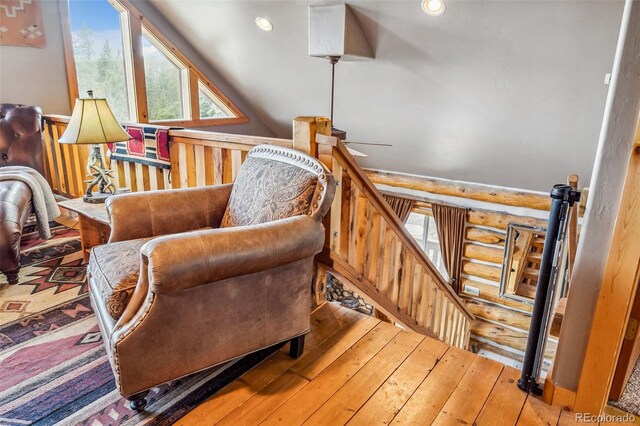 795 Zebulon St, Alma, CO 80420 - sitting room featuring hardwood / wood-style flooring, ceiling fan, and rustic walls