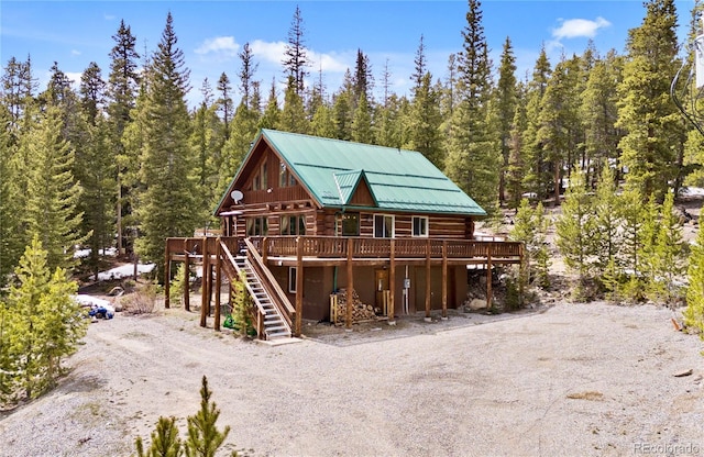 795 Zebulon St, Alma, CO 80420 - view of outdoor structure featuring a forest view, stairway, and dirt driveway