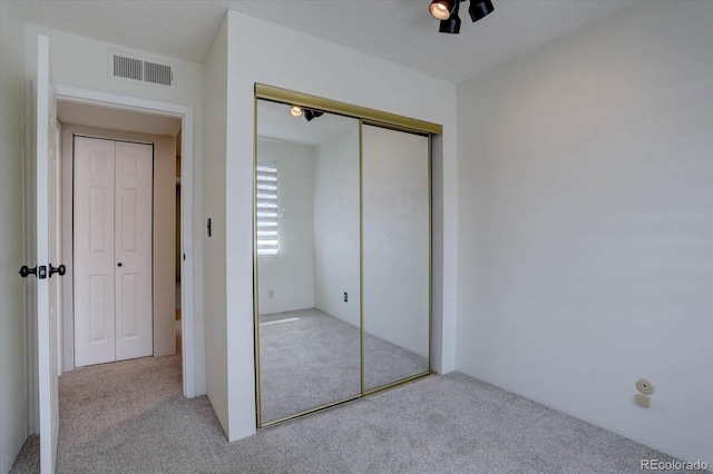 6844 S Broadway, Littleton, CO 80122 - unfurnished bedroom featuring light carpet and a closet