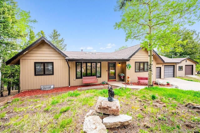 11094 Thomas Dr, Conifer, CO 80433 - view of front of property featuring a garage and concrete driveway
