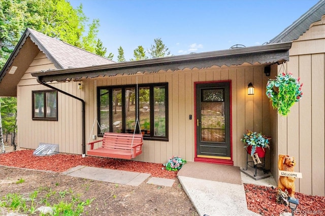 11094 Thomas Dr, Conifer, CO 80433 - view of exterior entry featuring a porch