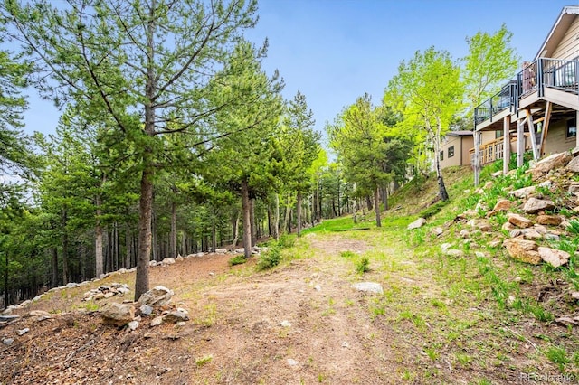 11094 Thomas Dr, Conifer, CO 80433 - view of yard with a wooden deck