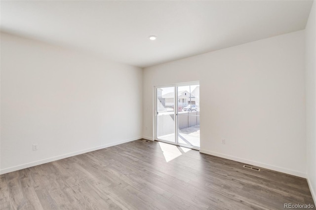 unfurnished room featuring light hardwood / wood-style floors