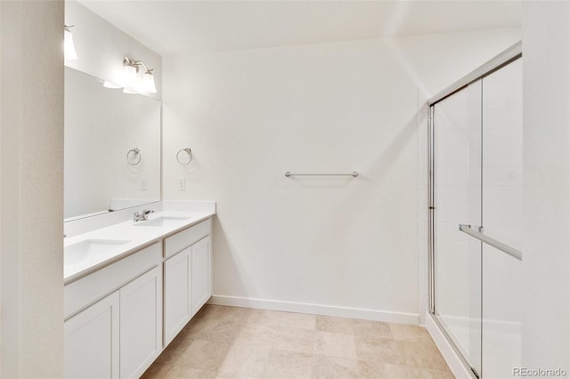 bathroom featuring an enclosed shower and vanity