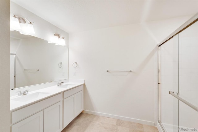 bathroom featuring vanity and an enclosed shower