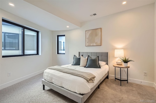 bedroom featuring light carpet