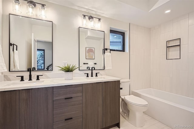 full bathroom with toilet, vanity, and tiled shower / bath combo