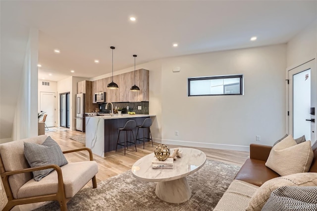 living room with light hardwood / wood-style flooring