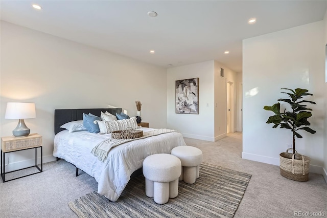 bedroom featuring light colored carpet