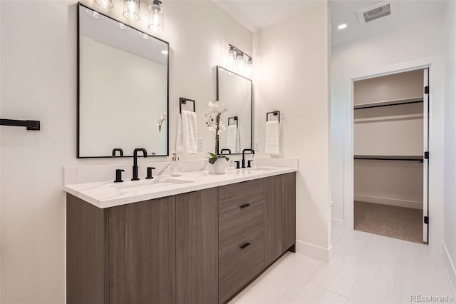 bathroom featuring tile patterned floors and vanity