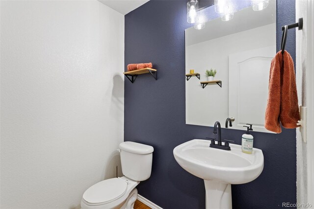 bathroom with sink and toilet