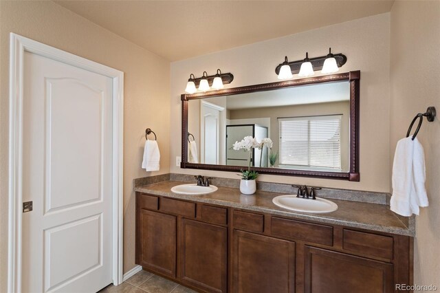 bathroom with tile patterned flooring and vanity