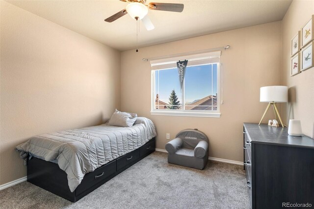 carpeted bedroom with ceiling fan