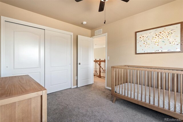 bedroom with ceiling fan, a closet, and carpet flooring