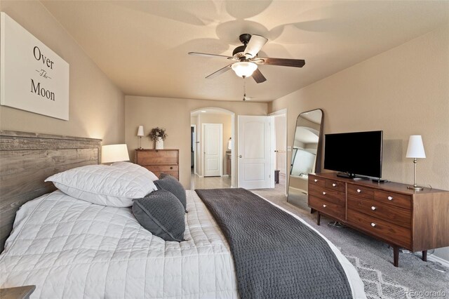 bedroom featuring ceiling fan and light colored carpet