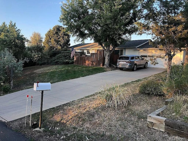 exterior space with a garage and a yard