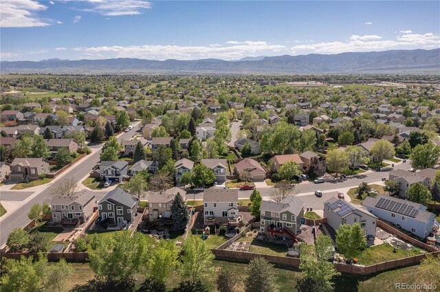 9719 Burberry Way, Highlands Ranch, CO 80129 - aerial view of residential area with a mountain backdrop