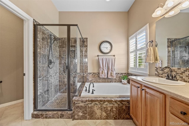 1251 Double Eagle Ct, Castle Rock, CO 80104 - full bathroom featuring vanity, a shower stall, a garden tub, and tile patterned flooring