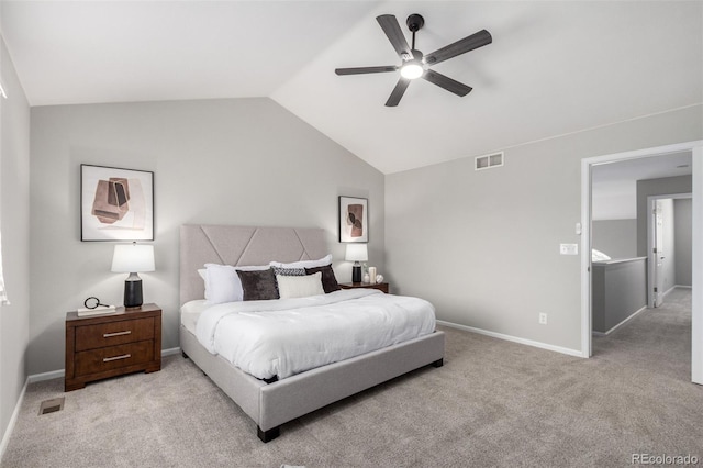 carpeted bedroom with vaulted ceiling and ceiling fan