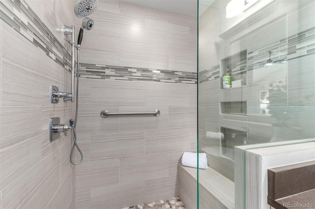 bathroom featuring a tile shower