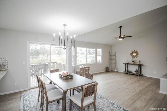 329 Lodgewood Ln, Lafayette, CO 80026 - dining area with a chandelier, light wood finished floors, baseboards, and a ceiling fan