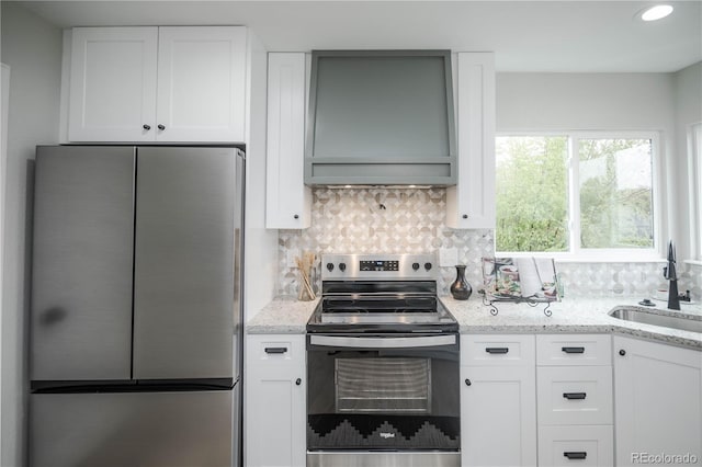 329 Lodgewood Ln, Lafayette, CO 80026 - kitchen featuring appliances with stainless steel finishes, a sink, and white cabinetry