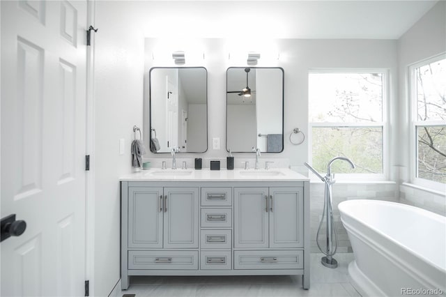 329 Lodgewood Ln, Lafayette, CO 80026 - bathroom with a freestanding tub, double vanity, and a ceiling fan