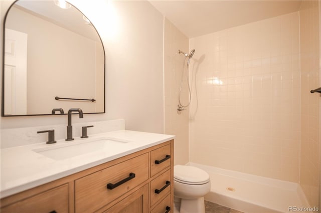 329 Lodgewood Ln, Lafayette, CO 80026 - bathroom with toilet, tiled shower, and vanity