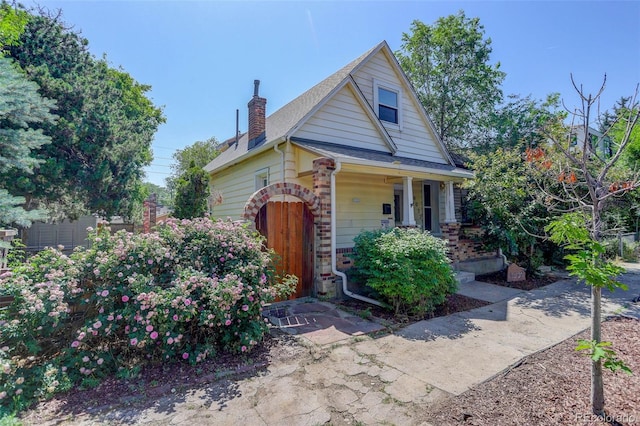 4032 Lipan St, Denver, CO 80211 - bungalow-style home featuring covered porch and a chimney