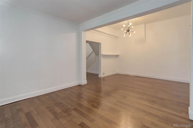4032 Lipan St, Denver, CO 80211 - spare room with a chandelier, crown molding, stairs, and hardwood / wood-style floors