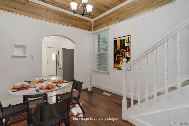 4032 Lipan St, Denver, CO 80211 - dining area featuring arched walkways, wood ceiling, stairs, dark wood-style floors, and a chandelier
