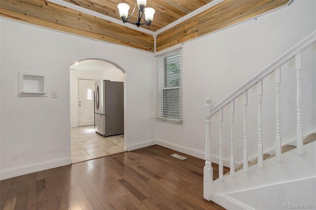 4032 Lipan St, Denver, CO 80211 - spare room with wood ceiling, arched walkways, stairway, hardwood / wood-style flooring, and a chandelier