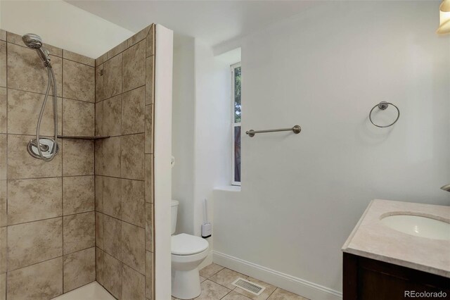 4032 Lipan St, Denver, CO 80211 - bathroom featuring a tile shower, tile patterned flooring, and vanity