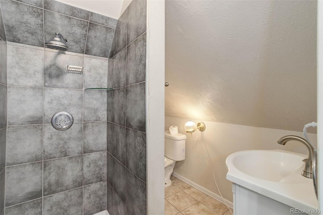 4032 Lipan St, Denver, CO 80211 - full bath featuring tile patterned flooring, a tile shower, vanity, and vaulted ceiling