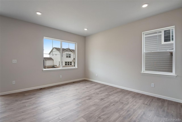 3443 N Gold Bug Ct, Aurora, CO 80019 - empty room featuring baseboards, wood finished floors, and recessed lighting