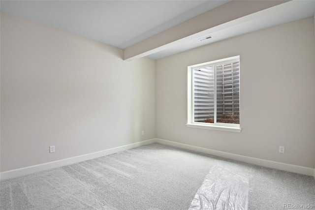 3443 N Gold Bug Ct, Aurora, CO 80019 - unfurnished room with carpet floors, baseboards, beamed ceiling, and visible vents
